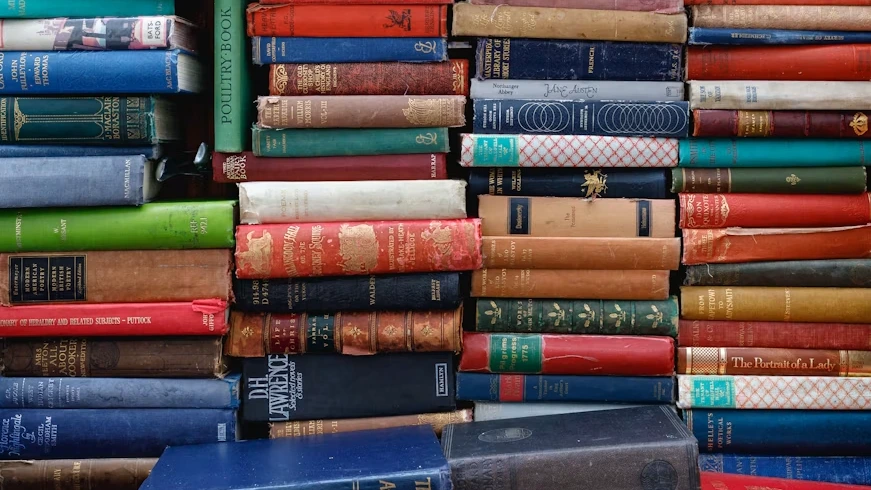 Colorful book spines arranged side by side, representing the diversity of the 2026 Booker Prize longlist
